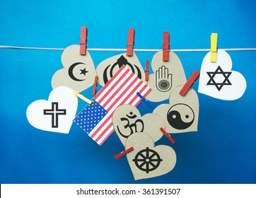 White  hearts,  USA ( America) flag hanging on colorful pegs ( clothespin ) on a line against a blue background.  United States of America  Concept - Religious Freedom Day (January 16) - Powered by Shutterstock