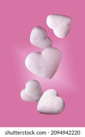 White Heart-shaped Cookies Flying On Pink Background