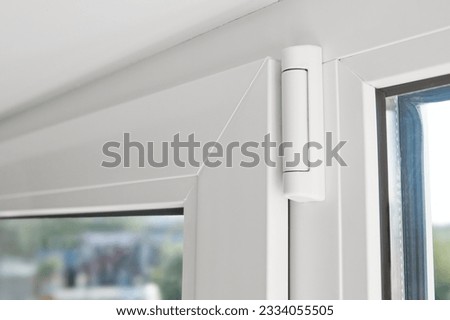 White hinge connector of PVC window frame. Window frame Furniture elements. Mechanism of white plastic window sash. Plastic window profile inside