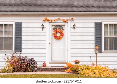 White Home Exterior Beautifully Decorated In The Fall With Autumn Decor For Thanksgiving And Halloween