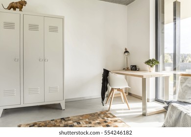 White Home Interior With Metal Wardrobe, Desk And Chair