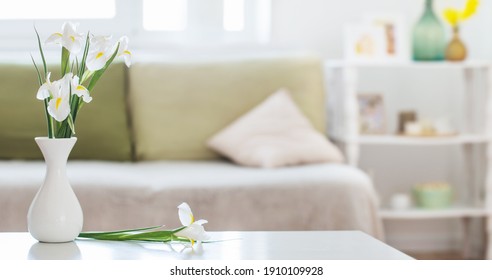 White Home Interior With Spring Flowers And Decorations