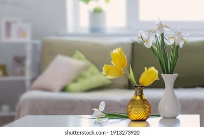 White Home Interior With Spring Flowers And Decorations