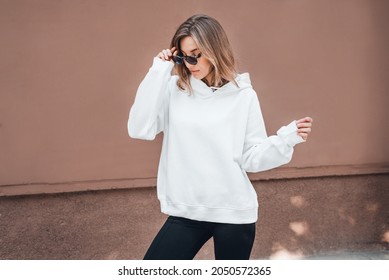 White Hoodie On A Young Woman, Mockup. Lifestyle.