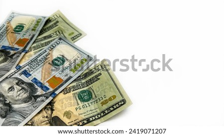 White horizontal background on it isolated money. Dollars.  Bills. $20. 100$. $260. American money. Currency exchange, exchange rate, stock exchange. Empty space for inscriptions or advertisements.