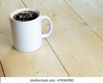 White Hot Mug Or Coffee Cup With Stream On Wood Table