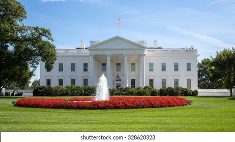 White House With Flag, Lawn, Fountain At Summer Day.