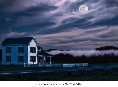 White House With Picket Fence On A Moonlit Night In The Countryside