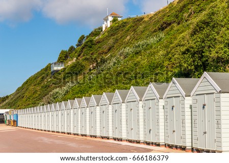 white houses on the beach, white door to summer cottages, seaside spot, vacation