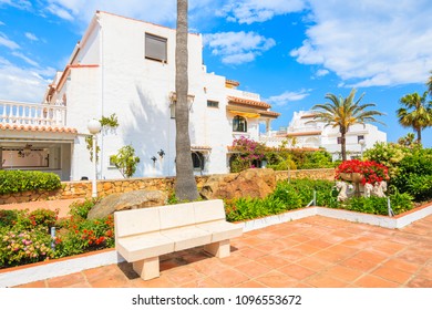 White Houses And Tropical Plants In Small Coastal Village Near Marbella, Costa Del Sol, Spain