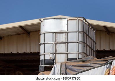 white ibc container in outdoor stock yard of factory, white plastic chemical tank. - Shutterstock ID 1890737980