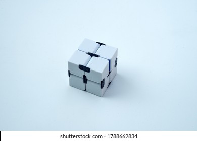 A white infinity cube on a white isolate. Antistress toy.