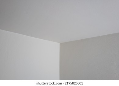 White Interior Apartment Walls. Corner Shot Of 2 Sidewalls And Ceiling Meeting. No People