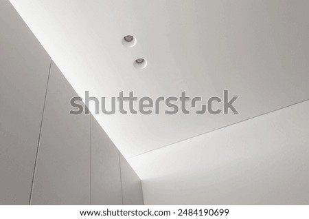 White interior ceiling with recessed downlight