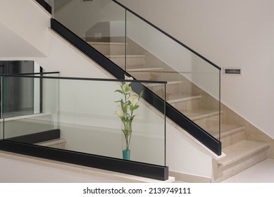 White Interior With Glass Fence And Stairs