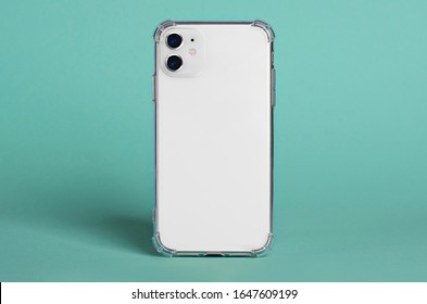 White IPhone 11 In Clear Silicone Case Back View Isolated On Green Background, Phone Case Mock Up IPhone 12