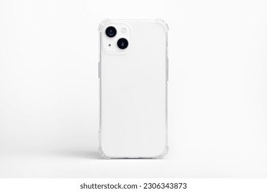 white iPhone 14 starlight in clear transparent soft silicone case back view. Phone case mockup isolated on grey background