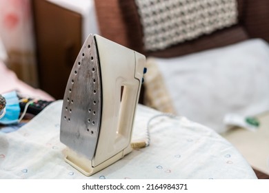 White Iron On Table, In A Real And Humble House.