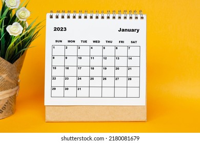 White January 2023 calendar with potted plant on yellow background. 2023 New Year Concept - Shutterstock ID 2180081679