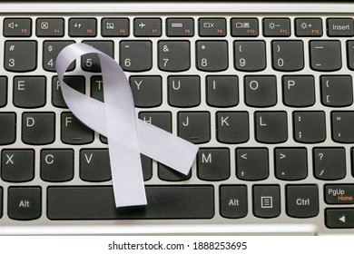 White January, Mental Health Awareness Campaign. White Ribbon On The Computer Keyboard, 