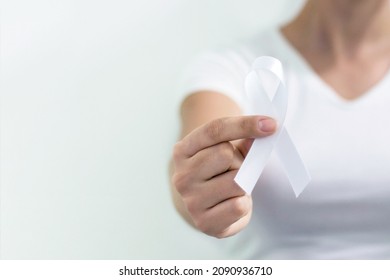 White January, Mental Health Awareness Campaign. Woman Holding A White Ribbon.