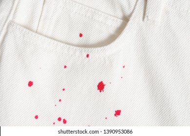 jeans with red paint splatter