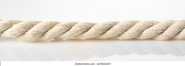 White Jute Rope Banner Size. Piece Of Ship Rope, Close-up On White Background.