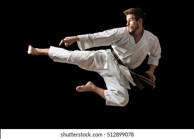 White Karate Fighter Isolated On Black - Powered by Shutterstock