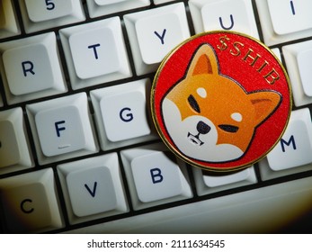 White Keyboard Of Personal Computer, Laptop And Shiba Inu Cryptocoin. Mining, Crypto Farm, Small Business, Video Cards, Computer Equipment, New Technologies.