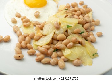 White Kidney Beans With Egg And Potato. Cooked Cannellini Bean Pile, Baked Legume, Yellow Beans Breakfast On White Plate