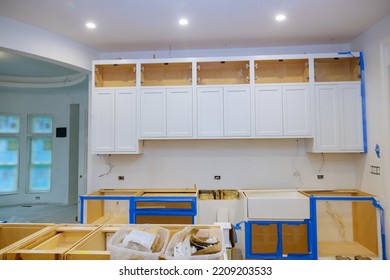 White Kitchen Cabinet Installation In Newly Constructed House Was Carried Out By Contractor