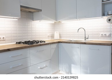 White Kitchen, White Cabinets And Solid Wood Worktop, Gas Stove And Faucet.