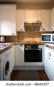 White Kitchen In Small UK Home Vertical View