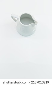 White Kitchen Table With Empty Milk Jug View From Above