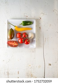 White kitchen table with vegetables an copy space