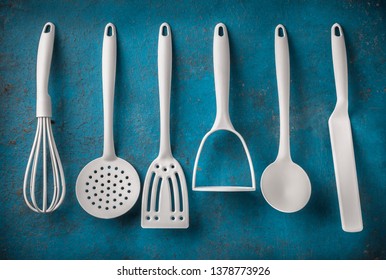 White Kitchen Tools Overhead Six Objects Arrangement On Blue Vibrant Rustic Wall Background In Studio