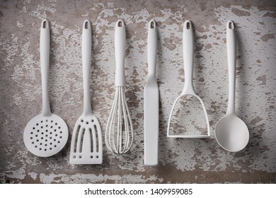 White Kitchen Tools Overhead Six Tool Objects Arrangement On Old Gray Rustic Wall Background In Studio