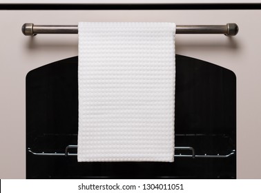 White Kitchen Towel Hangs On The Oven Handle, Product Mockup