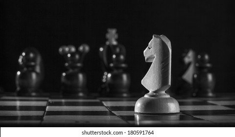 White Knight Chess Piece On The Board Background