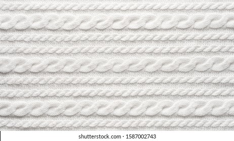 White Knit Fabric Background. Wool Sweater Texture Close Up