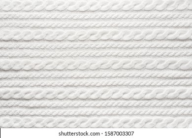 White Knit Fabric Background. Wool Sweater Texture Close Up