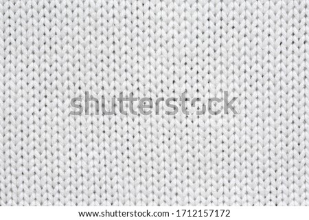 White knitted texture and background.