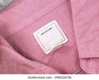 White Label On Pink Linen Shirt Close Up