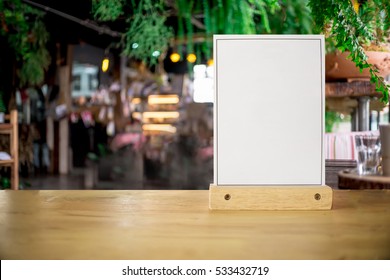 White Label On The Table. Stand For Acrylic Tent Card Used For Menu Bar And Restaurant Or Put Everything Into It . Mockup 