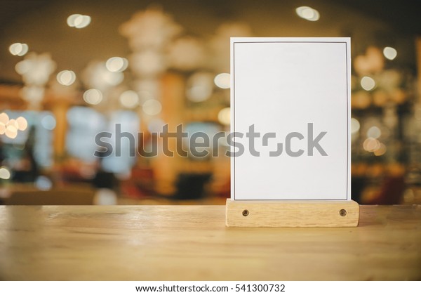 White\
label on the table. Stand for acrylic tent card Used for Menu Bar\
and restaurant or put everything into it . mockup\

