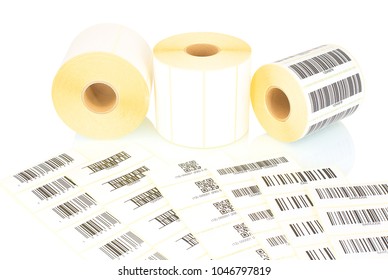 White label rolls and printed barcodes isolated on white background with shadow reflection. White reels of labels for printers. Labels for direct thermal or thermal transfer printing. Barcode samples.