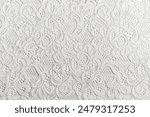 White Lace Fabric with Intricate Patterns, Detailed close-up of white lace fabric featuring delicate and intricate patterns, perfect for wedding dresses and decorative textiles.