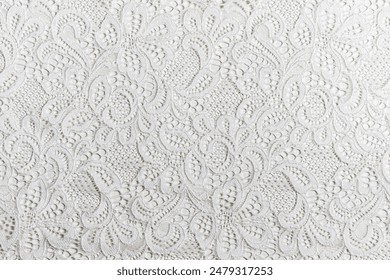 White Lace Fabric with Intricate Patterns, Detailed close-up of white lace fabric featuring delicate and intricate patterns, perfect for wedding dresses and decorative textiles. - Powered by Shutterstock