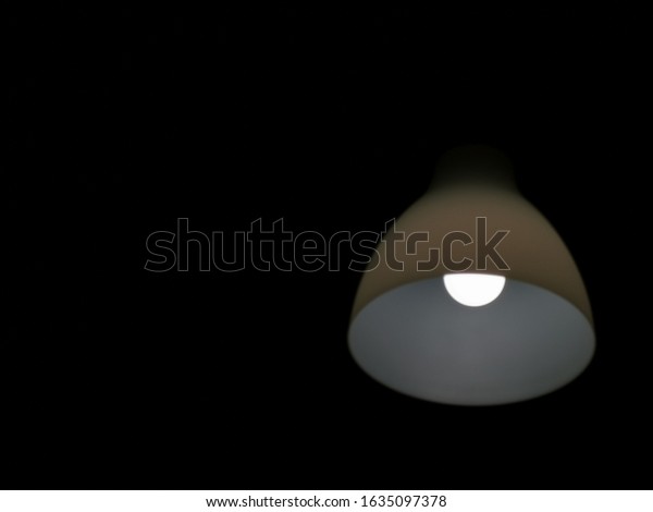 The white lamp glows in the\
dark.