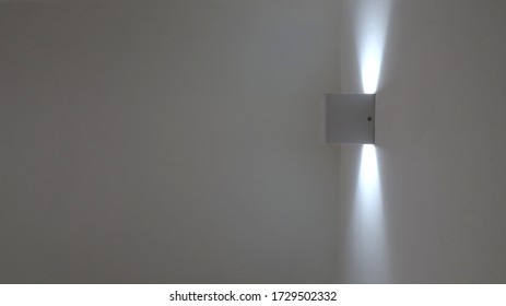 A white lamp on the wall - Shutterstock ID 1729502332